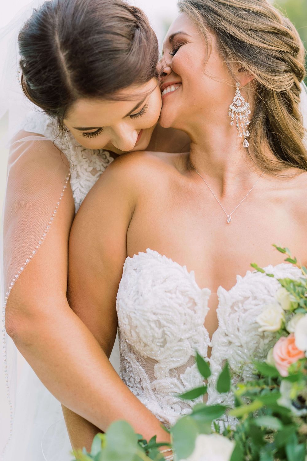 Two brides embracing after their LGBT ceremony in Stillwater, Oklahoma at Sparrow venue.