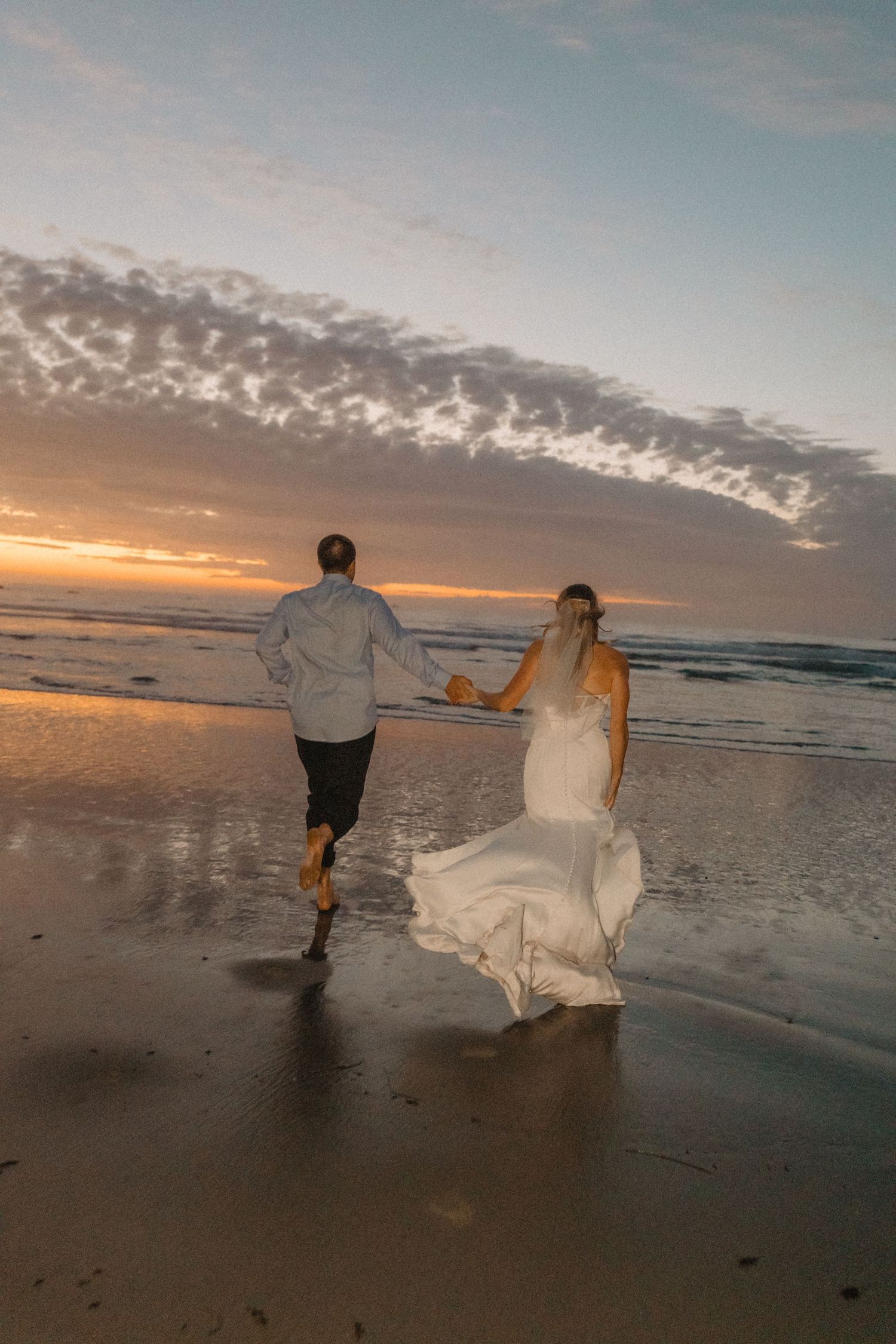 beach elopement photos of bride and groom