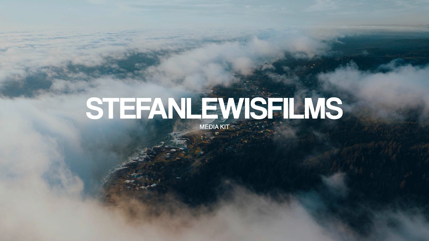 Aerial view of dramatic clouds rolling over mountains and valleys with text overlay reading 'STEFANLEWISFILMS'.