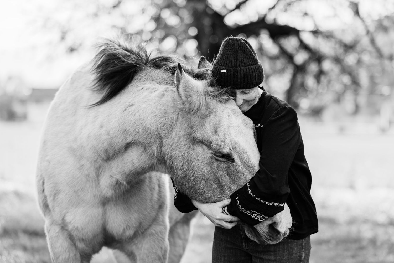Dr. Jeannine Berger hugs her senior horse in an intimate moment captured by Northern California Equine Photographer Lauren Ann Photography