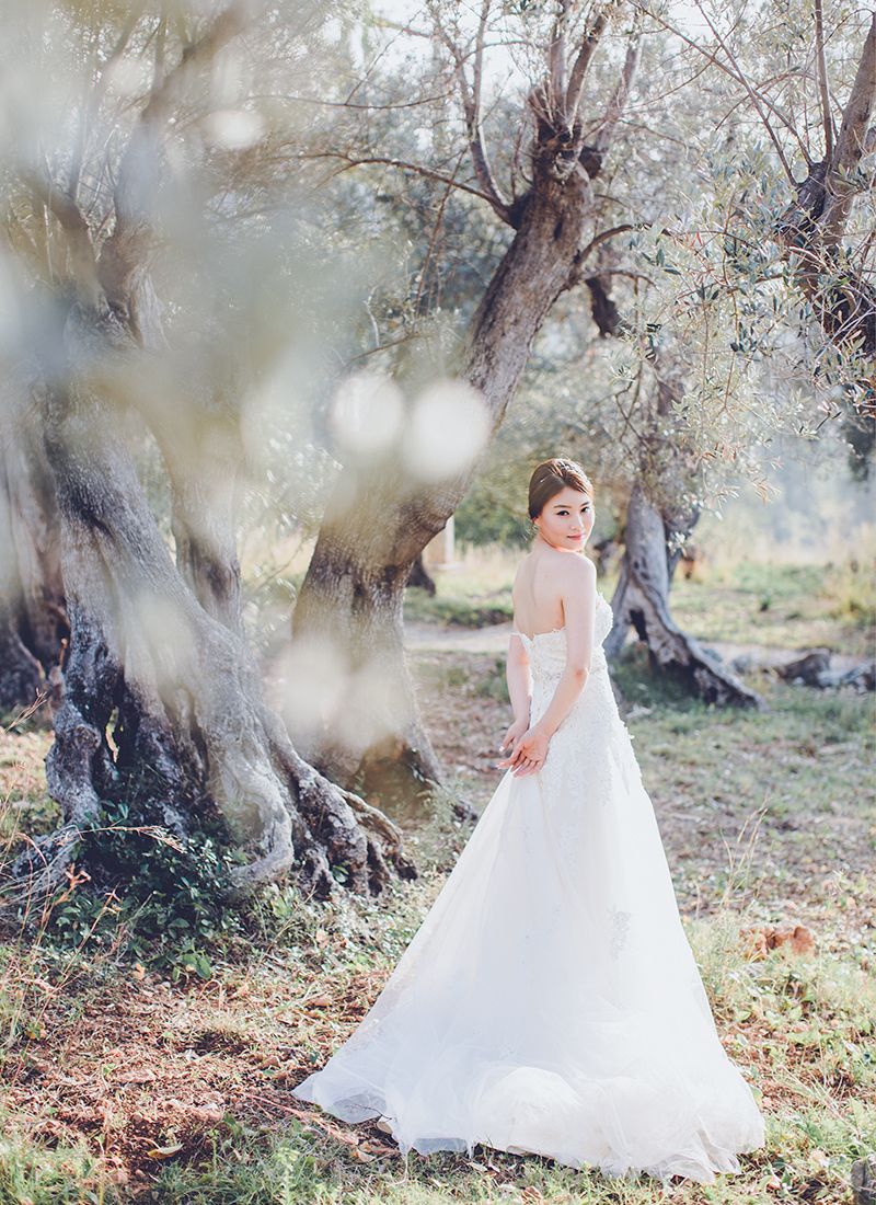 pre wedding couple portrait of bride among olive trees mallorca countryside