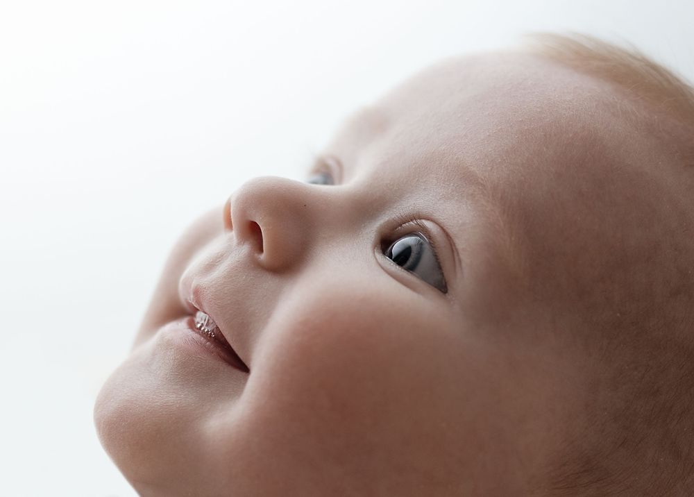 Backlit images of adorable, smiley, perfect, baby girl, captured by Charlottesville family, newborn, and maternity photographer.