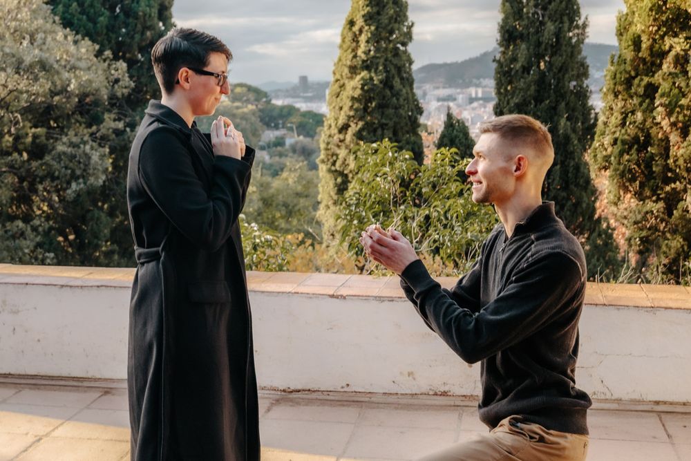 Romantic kiss overlooking Barcelona skyline Surprise proposal Barcelona BarcelonaLoversPH