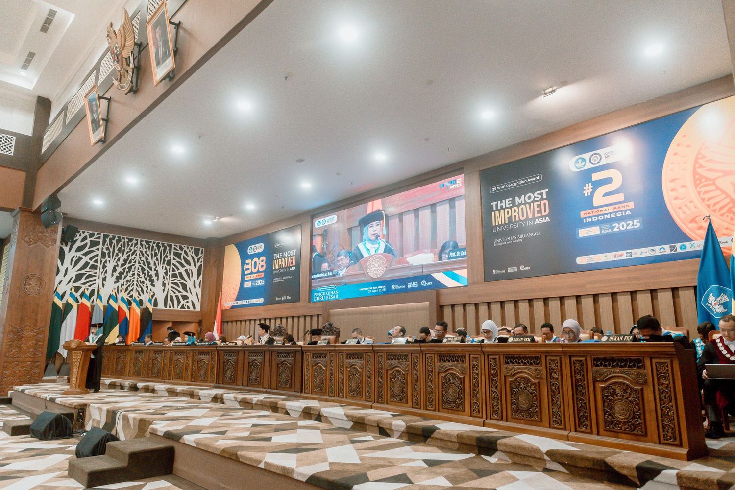 Modern restaurant interior with ornate wooden paneling and illuminated signage displays along the walls.