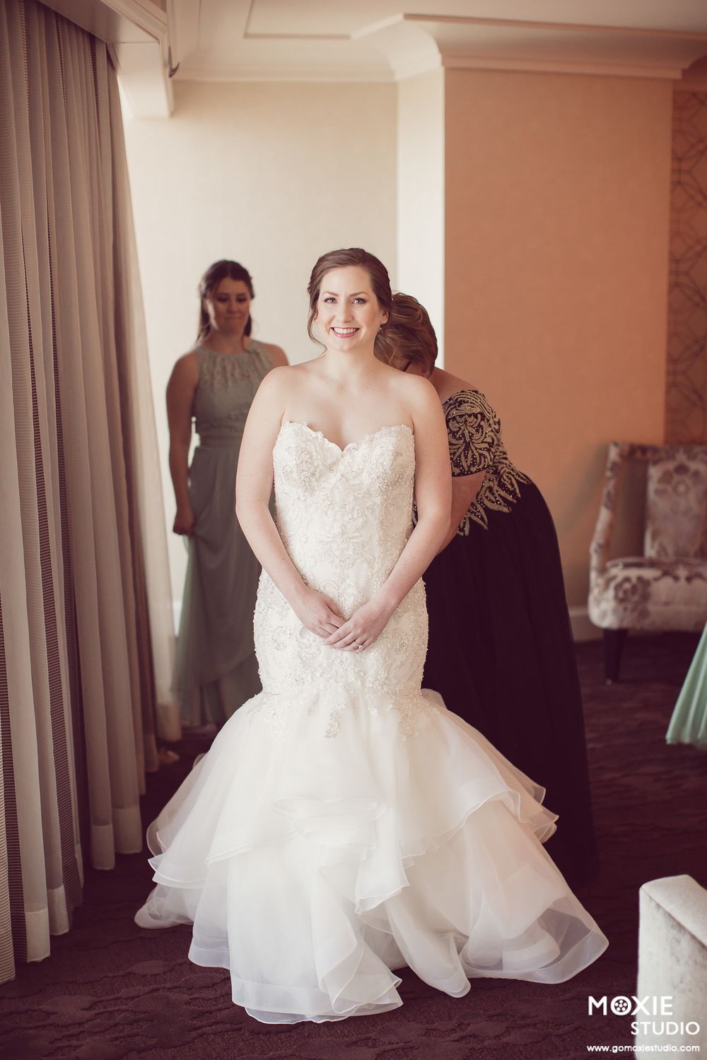 A series of candid moments showing a bride in a flowing white ballgown preparing for her wedding day.