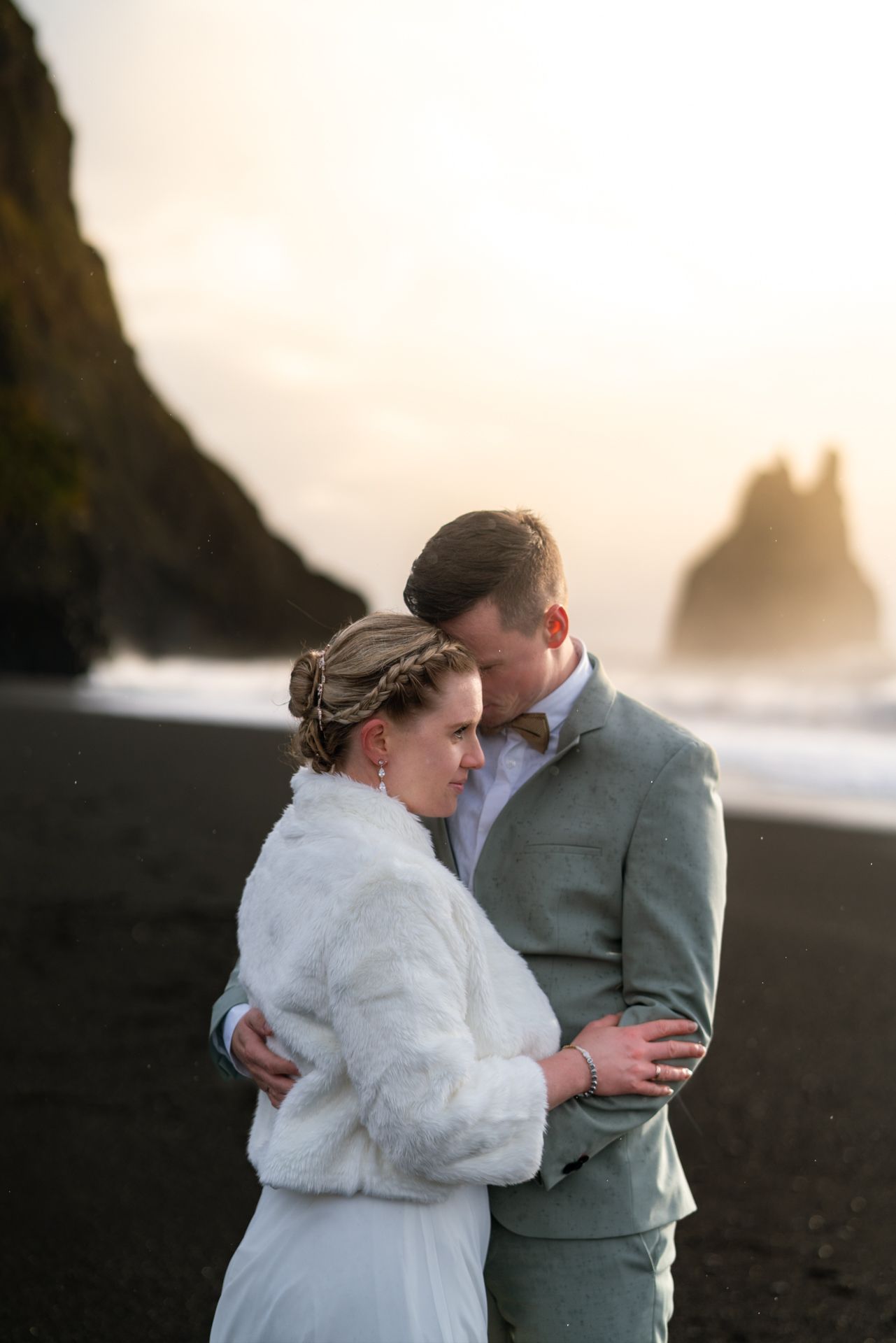 Couple in golden light at Reynisfjara