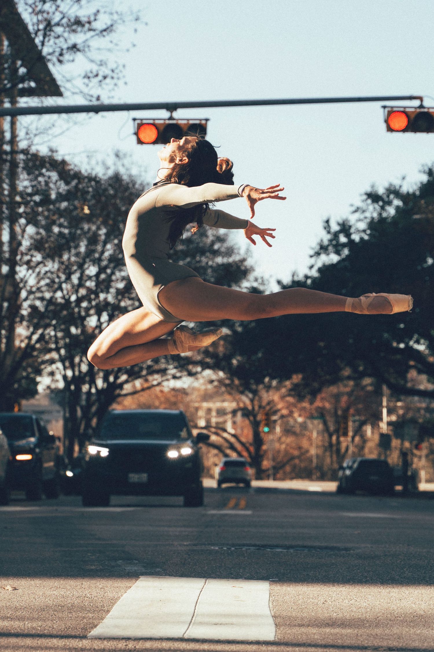 Ballet Austin company dancer in an outdoor dance photoshoot with downtown Austin city backdrop