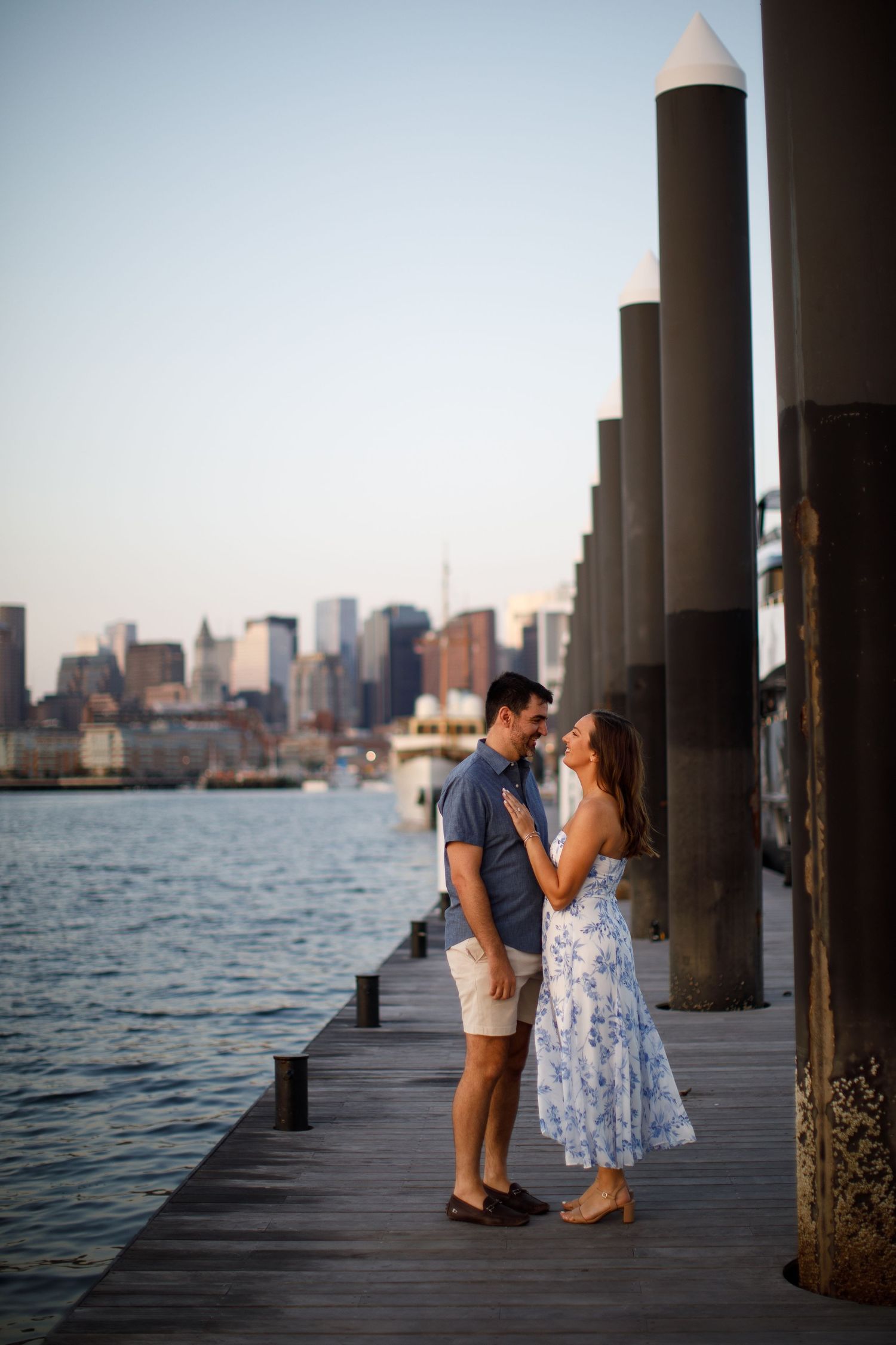 Engagement photo of a loving couple in front of Bug Light Lighthouse in South Portland, Maine.