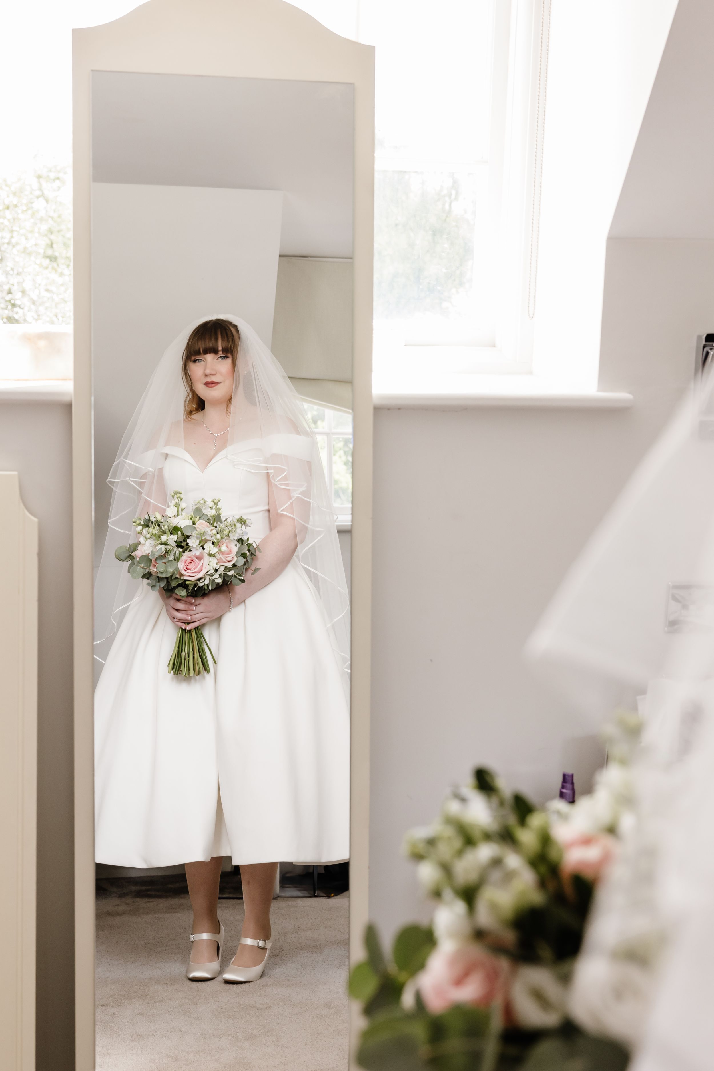 Bride looking in the mirror Barnett Hill Hotel