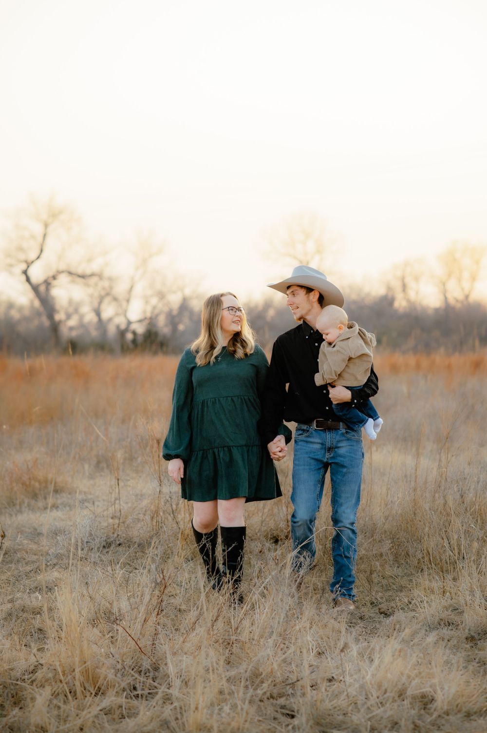 Couple poses with their baby for a Enid OK family photos.