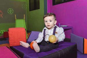 Colorful playroom with purple and green walls.