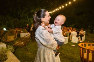 Outdoor evening celebration with string lights creating a warm ambiance.