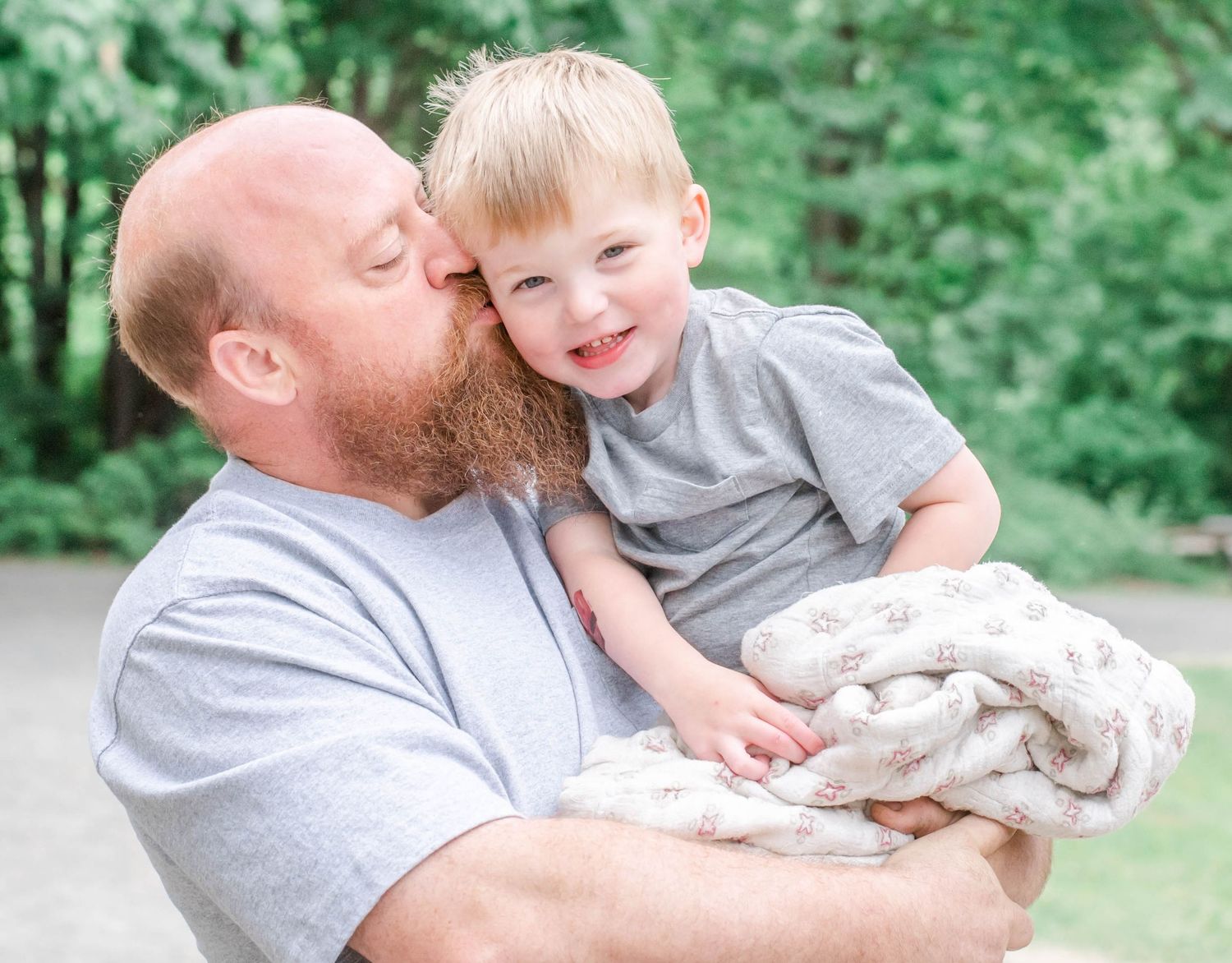 Intimate family portrait session in a serene garden setting.