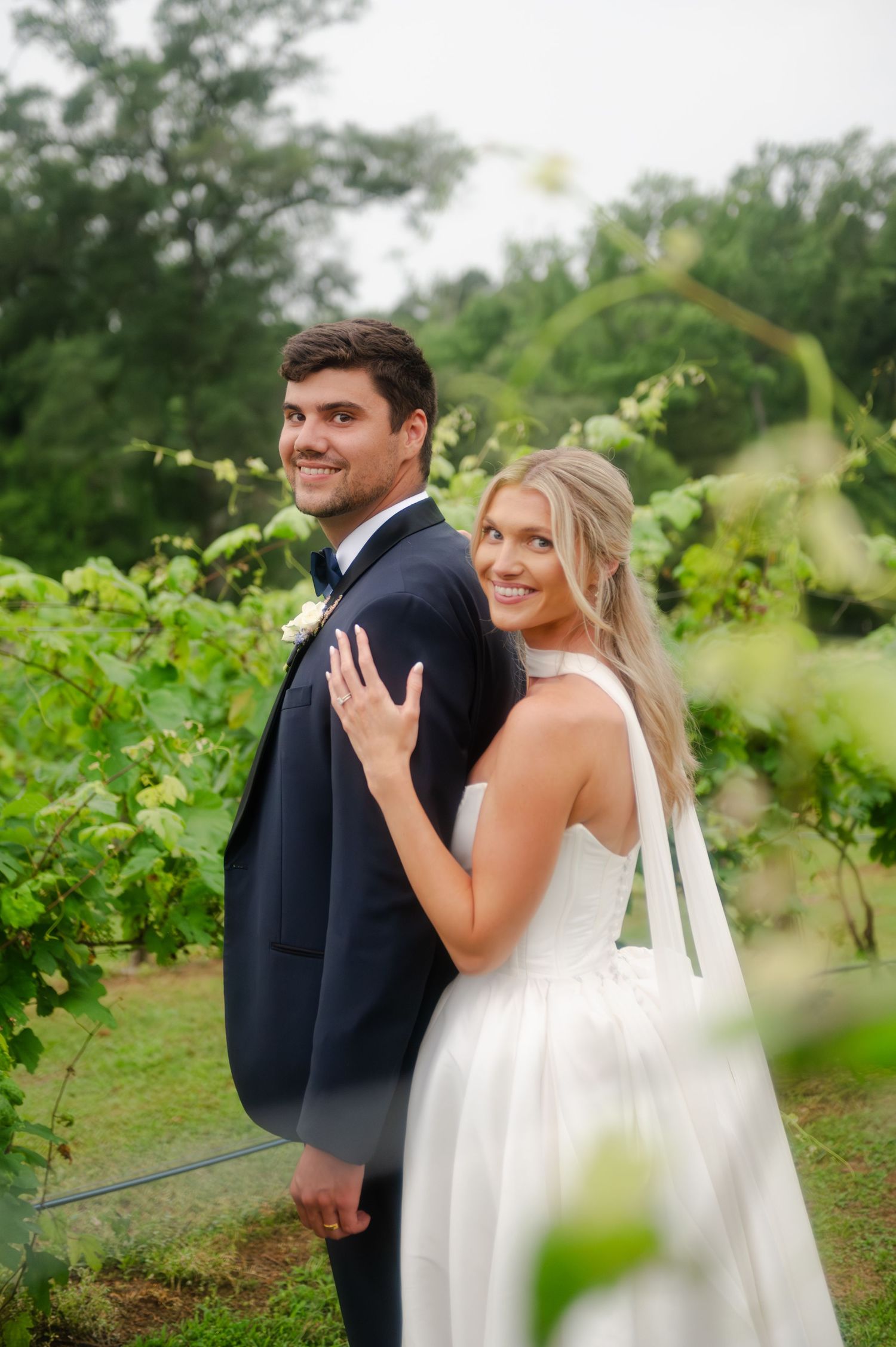 Stunning bride and groom portraits in the vineyards at High Hill Resort in Arp, Texas