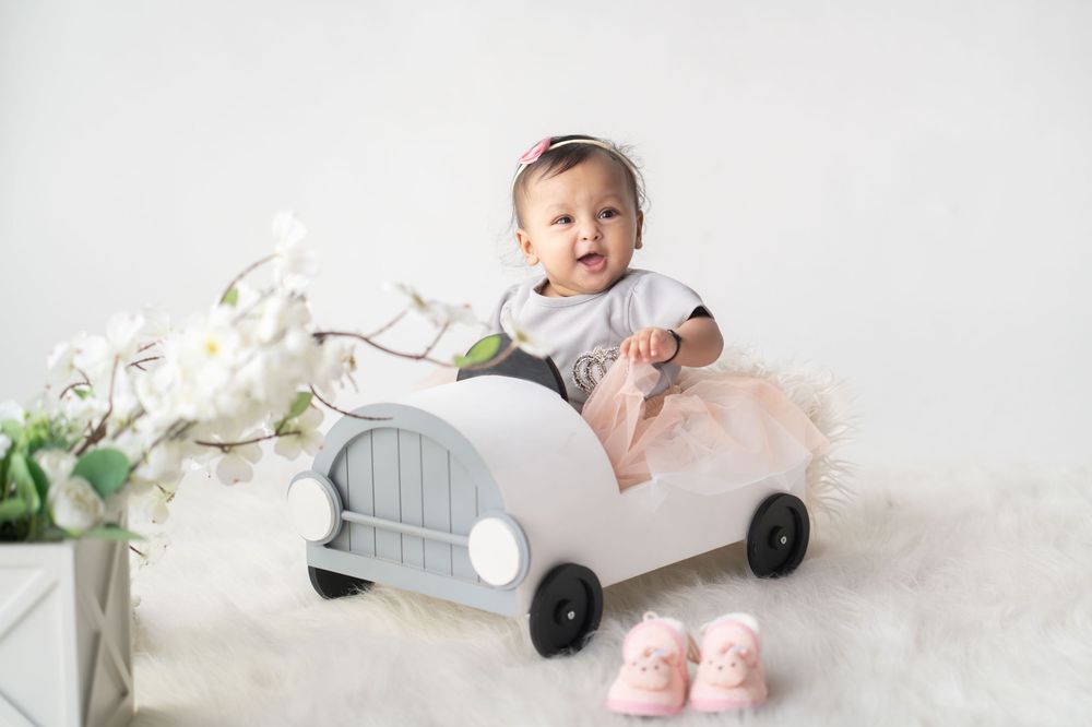 Three month old in a Four wheel car