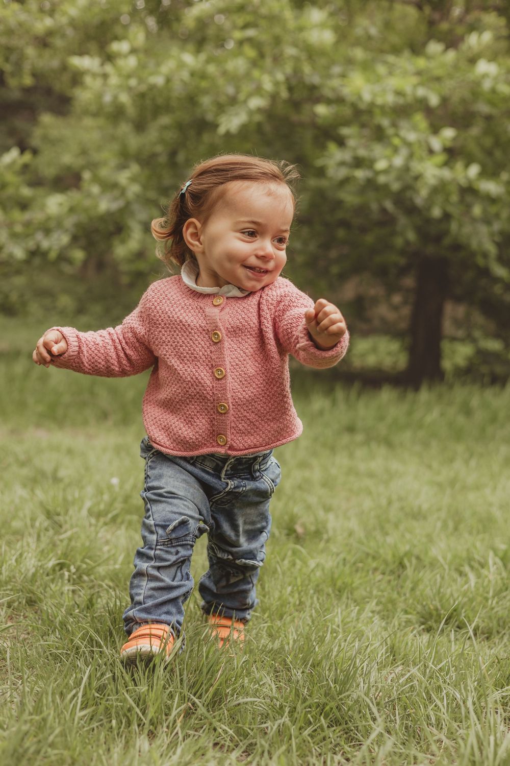 little girl runs towards camera