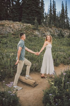 Engagement couple kissing together during their couples adventure photo session in Mt. Rainier National Park near Seattle Washington
