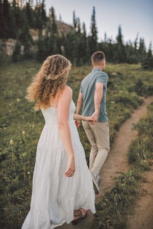 Engagement couple kissing together during their couples adventure photo session in Mt. Rainier National Park near Seattle Washington