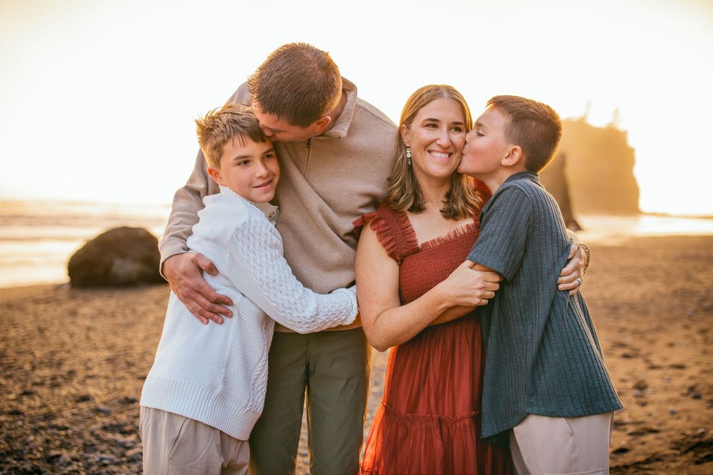 Family standing together during their adventure family photoshoot at Olympic National Park near Seattle, Washington