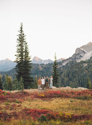 Family hiking and traveling to Mt. Rainier and standing together during a family photoshoot in Mt. Rainier National Park in Washington