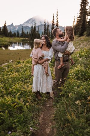 Family standing together during their adventure and family photoshoot at Mt. Rainier National Park near Seattle, Washington