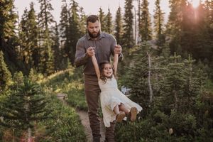 Family standing together during their adventure and family photoshoot at Mt. Rainier National Park near Seattle, Washington