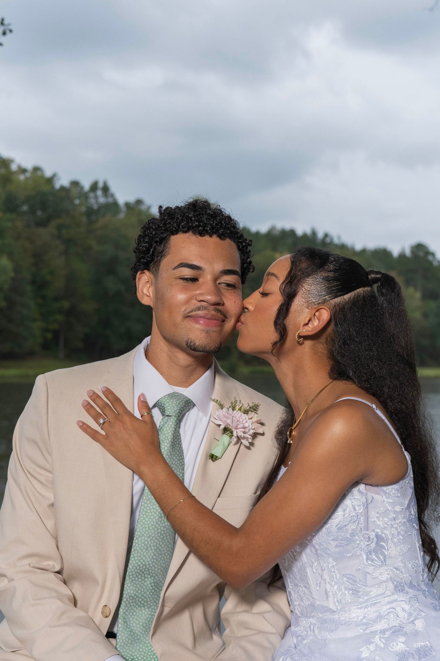 A romantic wedding couple in beige and white share tender moments in a series of affectionate outdoor portraits.