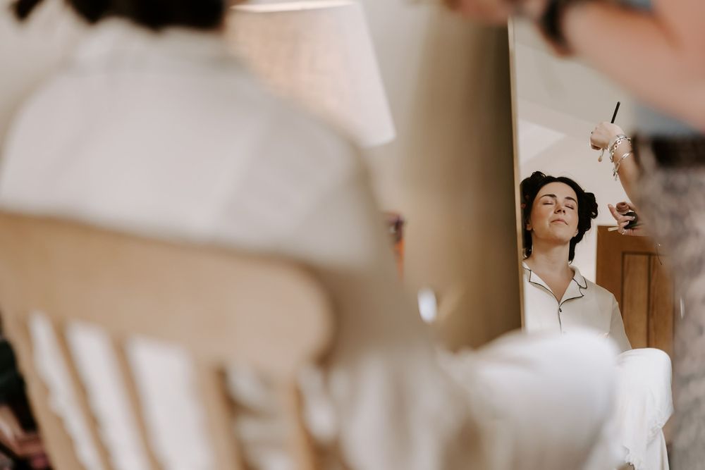 Artistic sequence of dance movements captured through multiple window panes in soft, natural lighting.