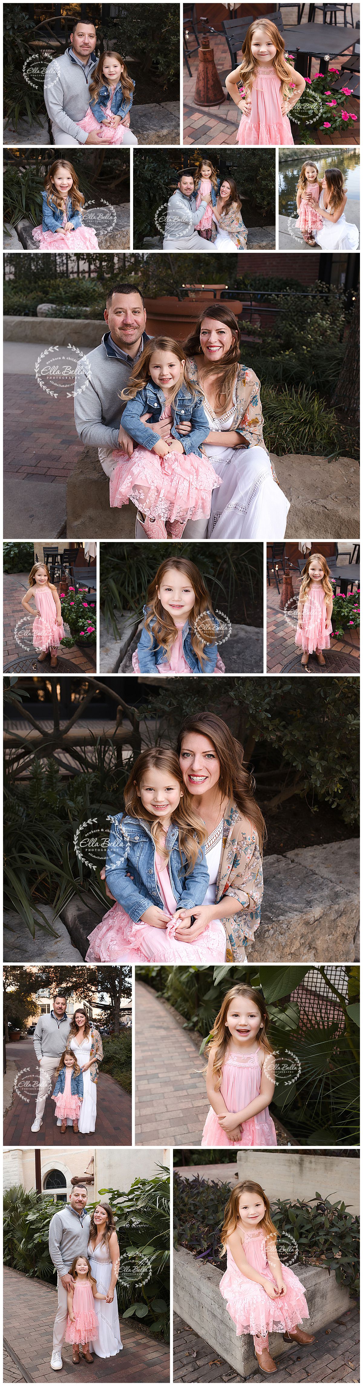 A family photo session in an outdoor garden setting with coordinated pink and blue outfits.
