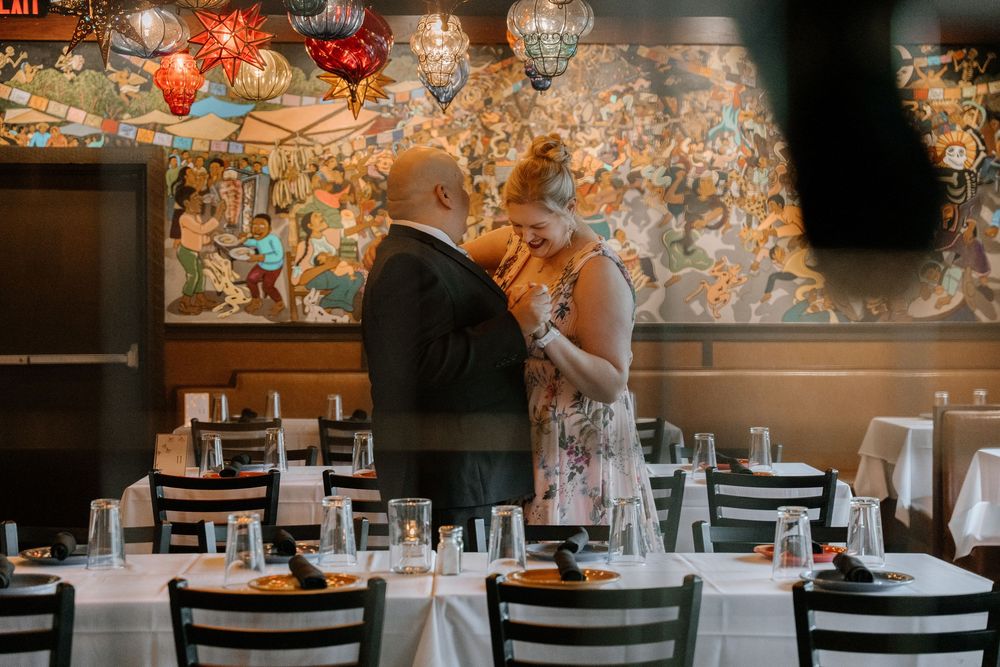 Restaurant interior decorated with warm glowing lanterns and string lights creating an intimate dining atmosphere.