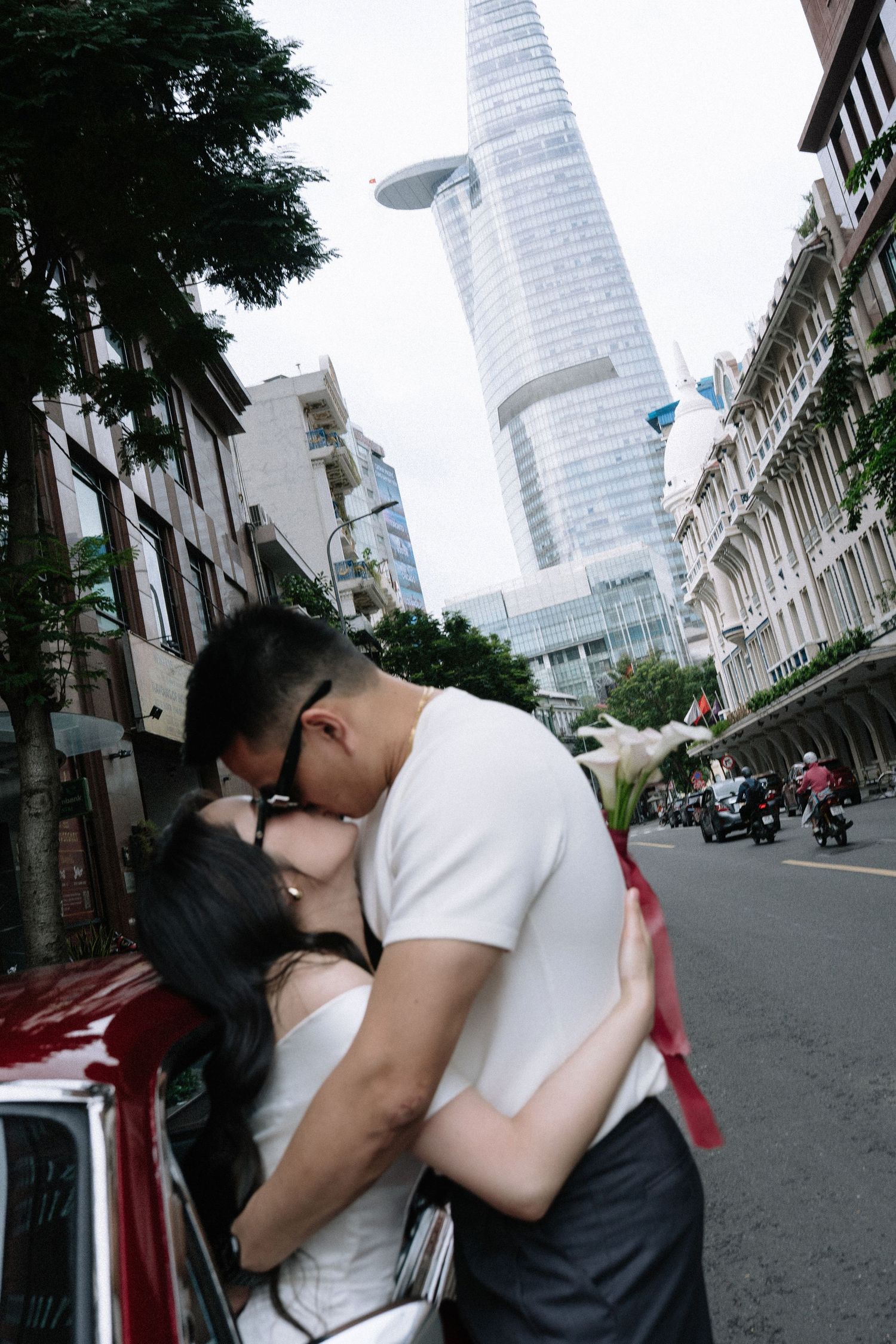 Saigon prewedding photography with a candid walking moment among book street trees