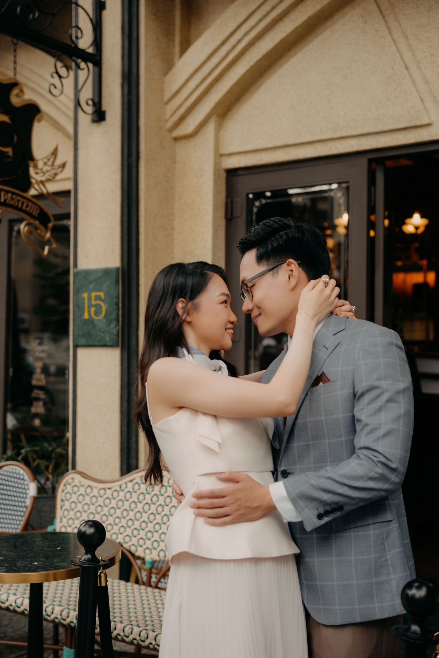 Romantic Ho Chi Minh rooftop prewedding photoshoot during golden hour skyline
