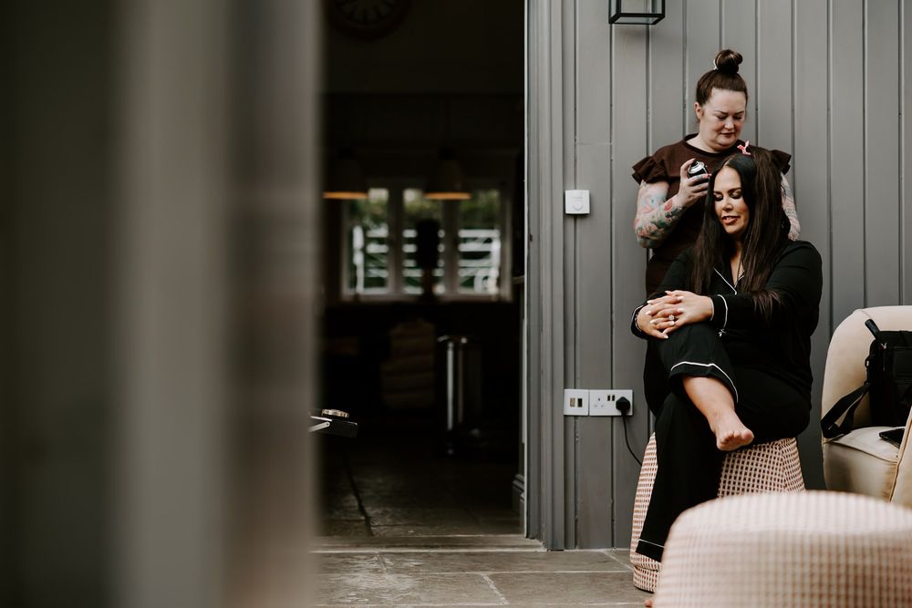 A couple embraces in a romantic moment during their engagement photo session at an urban location.