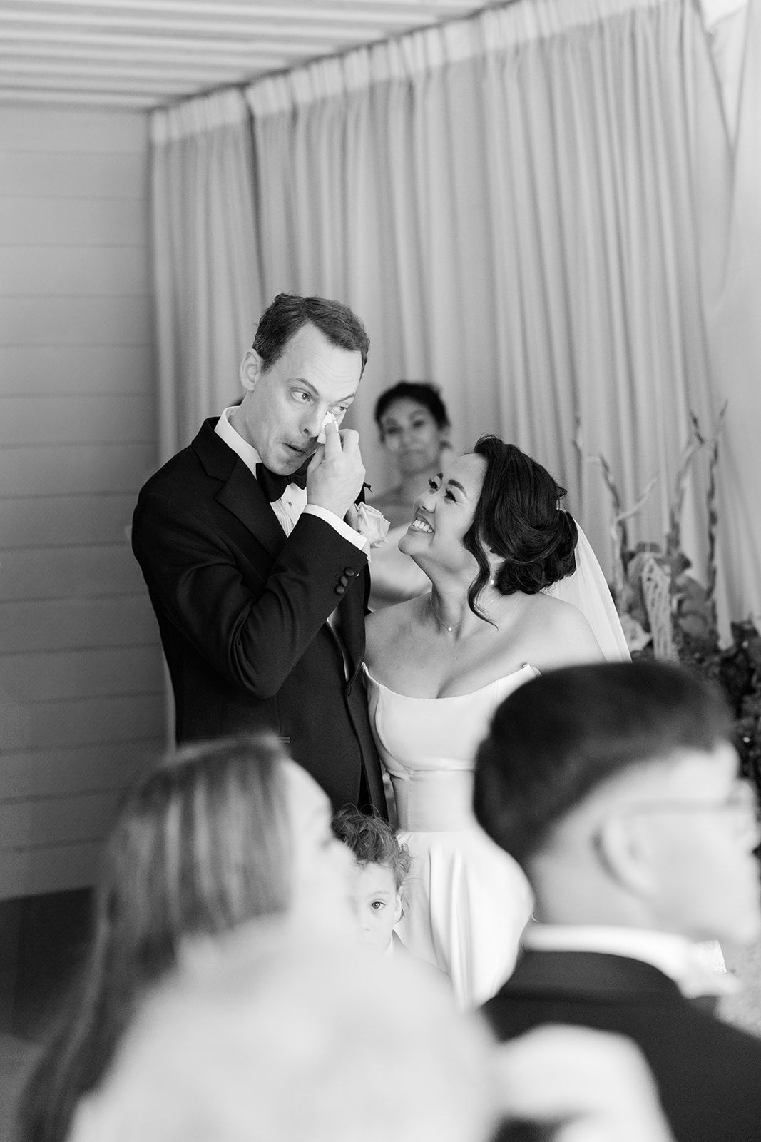 Black and white photo sequence showing tender moments between a bride and groom during their wedding reception.