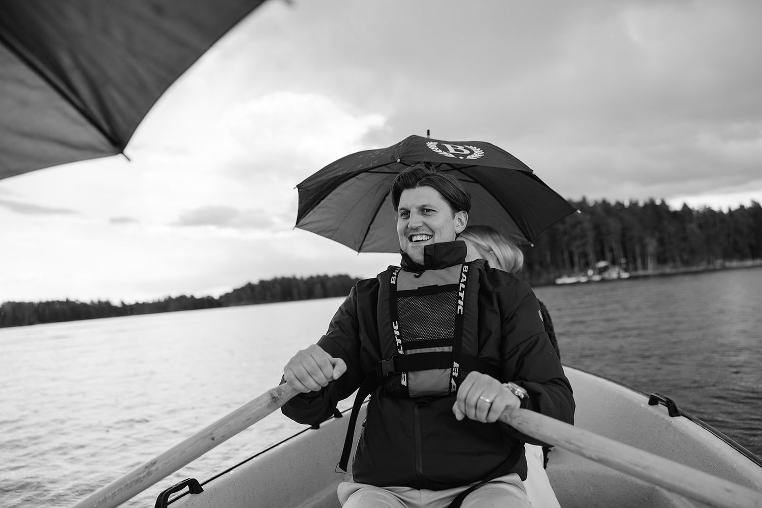 A series of kayaking photos showing paddlers on calm waters with overcast skies and forested shorelines in the background.