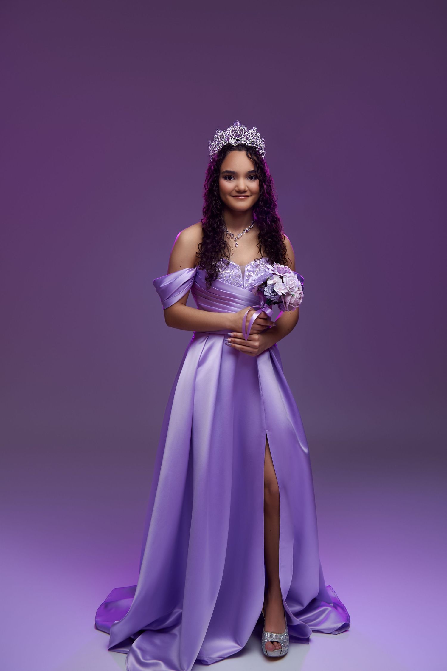 A purple evening gown photoshoot series showing a flowing dress against a vibrant purple studio backdrop.