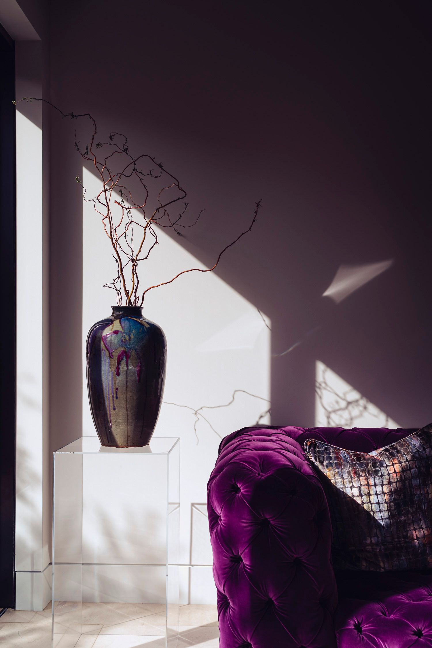 A bride in a lace dress with long sleeves stands near window light in an elegant silhouette series at  the ritz carlton, dana point