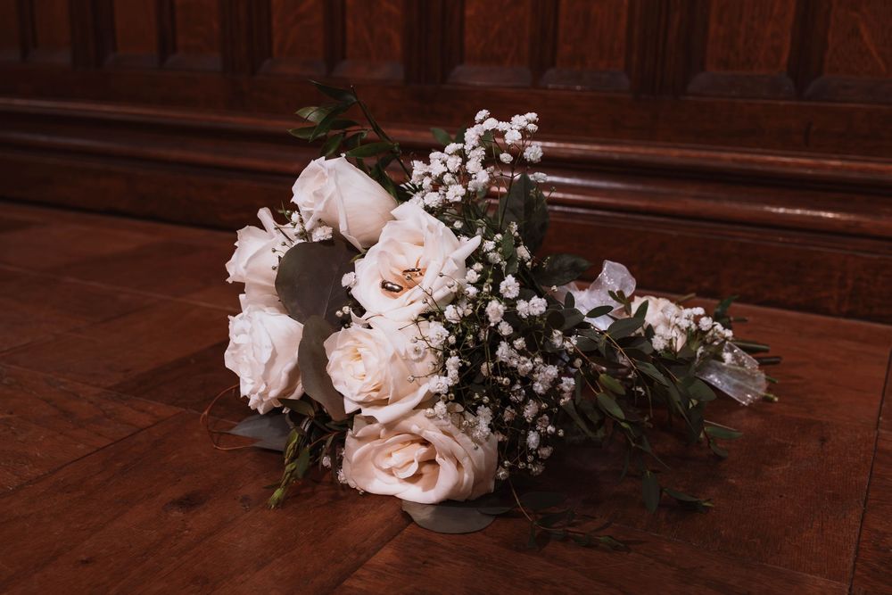 Close up of wedding rings and floral bouquet at North east wedding