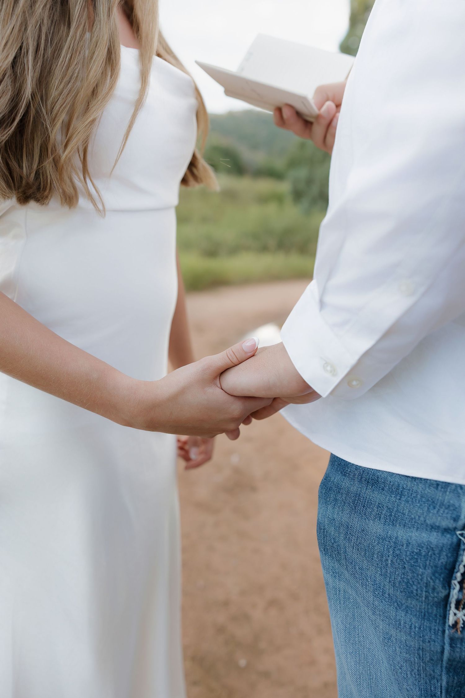 Close-up series of maternity photos showing pregnant belly in white dress against natural outdoor background.
