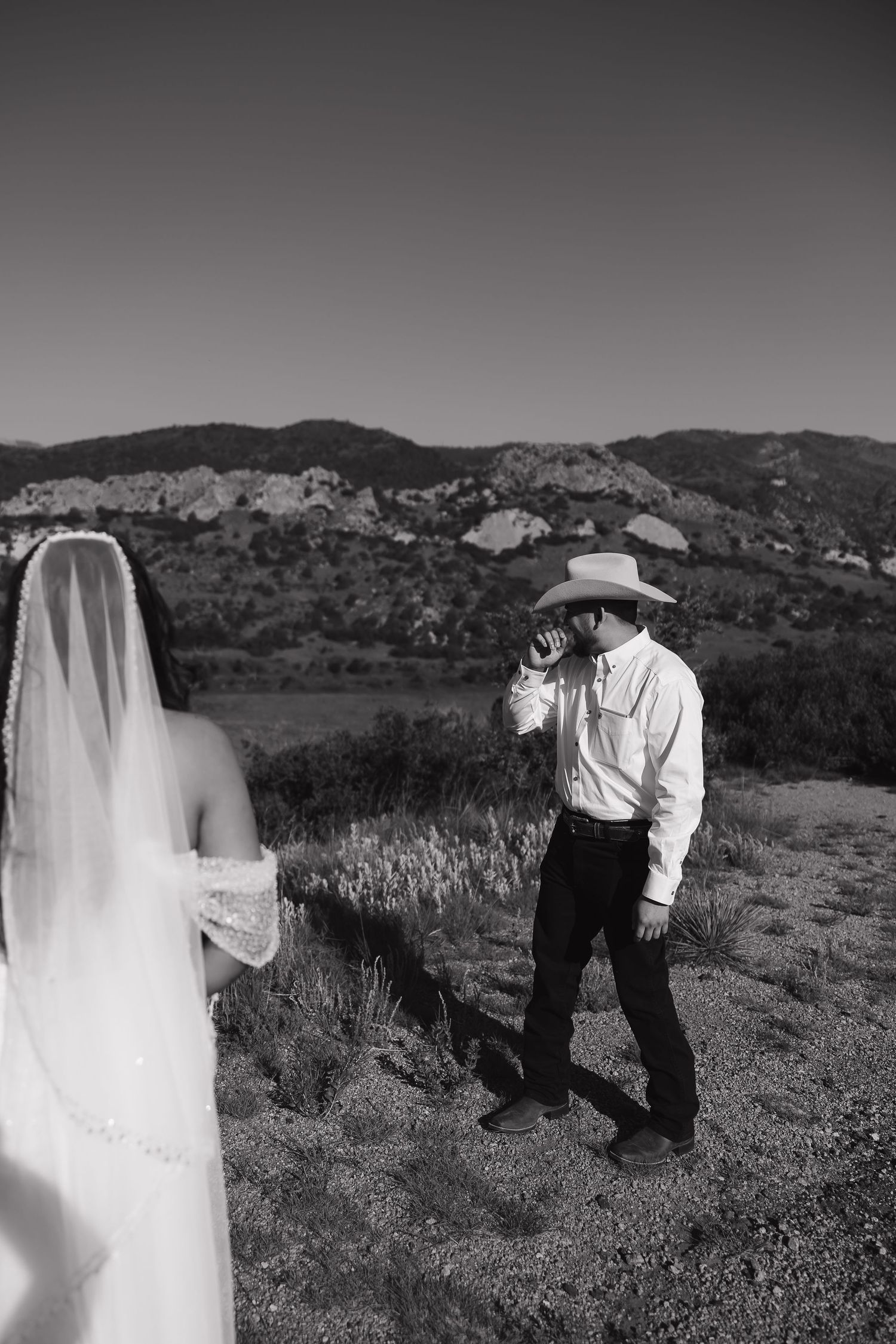A series of cropped black and white wedding photos showing candid poses of a couple in an outdoor mountain setting.