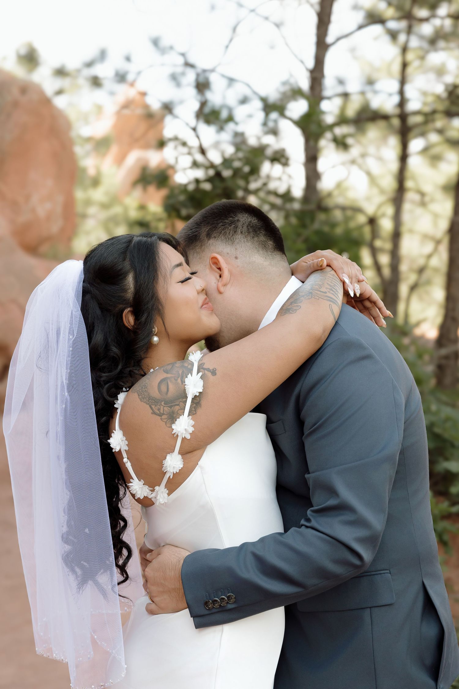 A tender wedding moment captured in sequence against pine trees and desert scenery.
