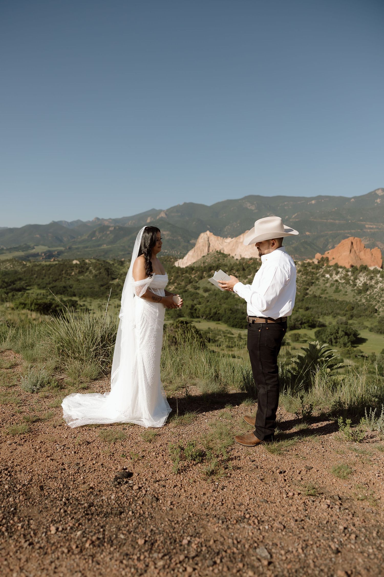 A wedding ceremony takes place against the stunning backdrop of Garden of the Gods in Colorado Springs.