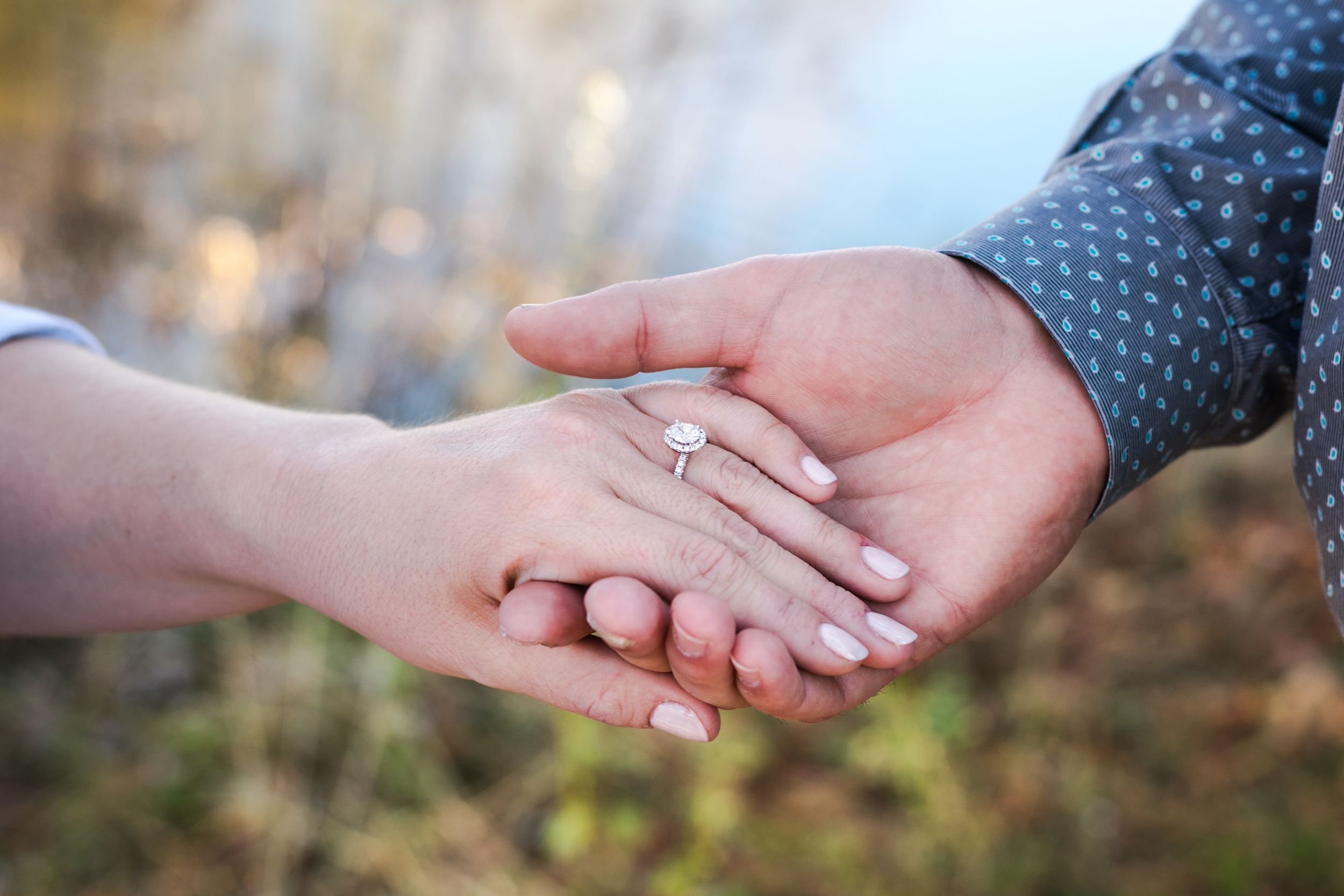 Series of intimate hand-holding shots in natural outdoor lighting.