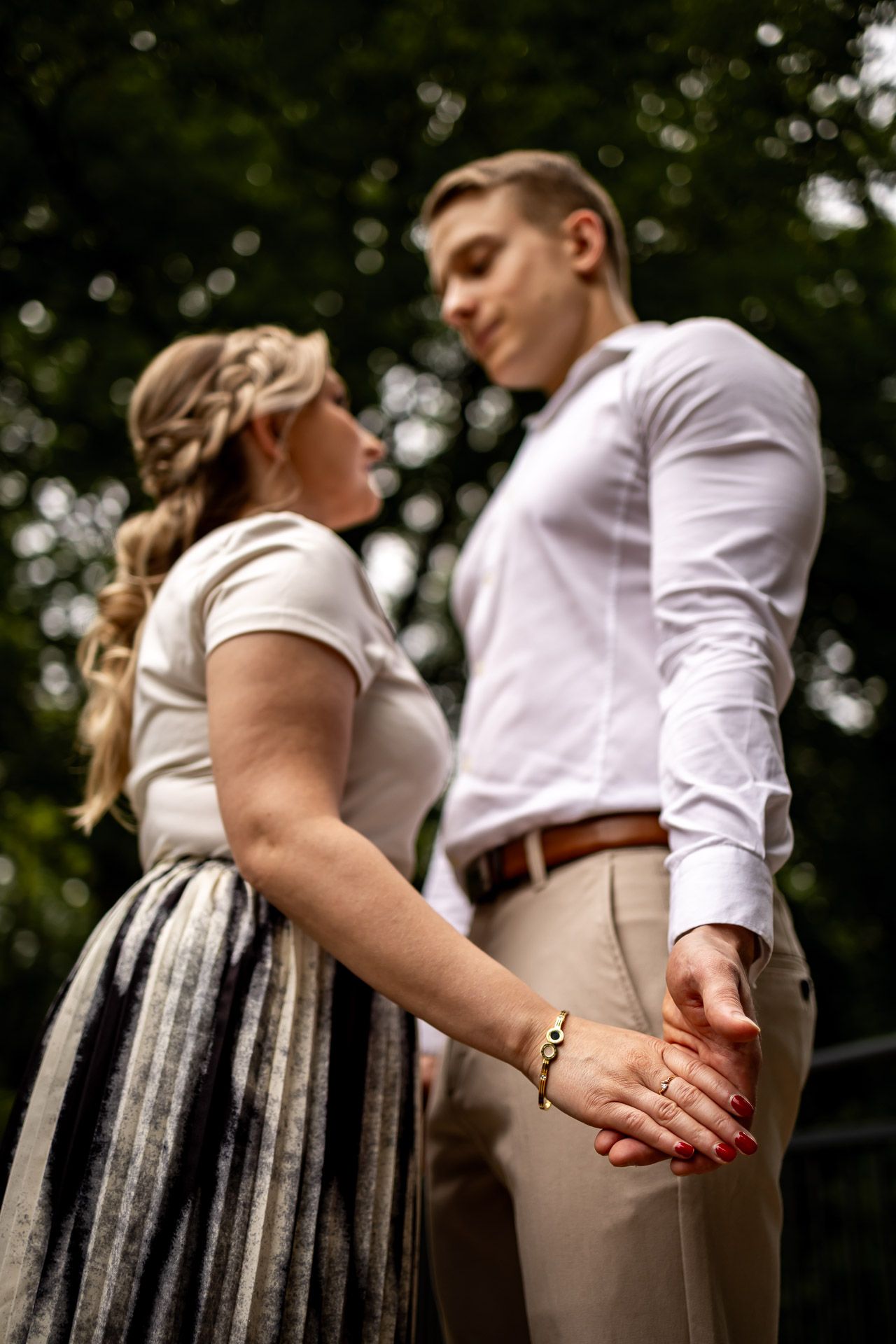 Close-up sequence showing gentle hand movements between a couple in casual attire.
