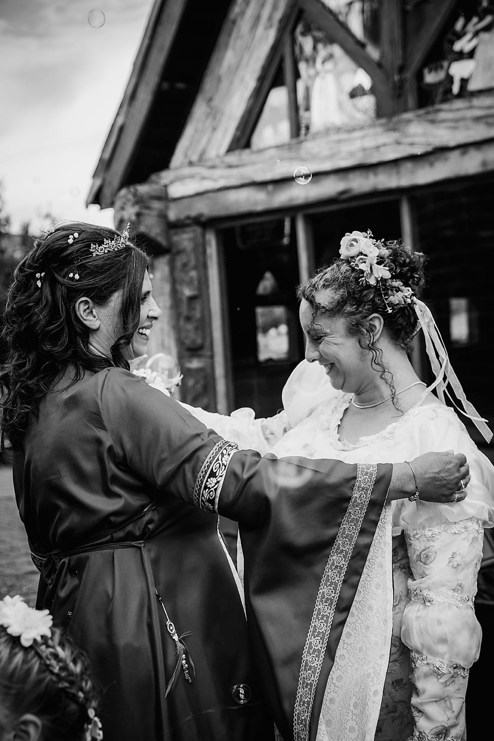 A candid black and white photo sequence showing a playful moment between people in formal attire.