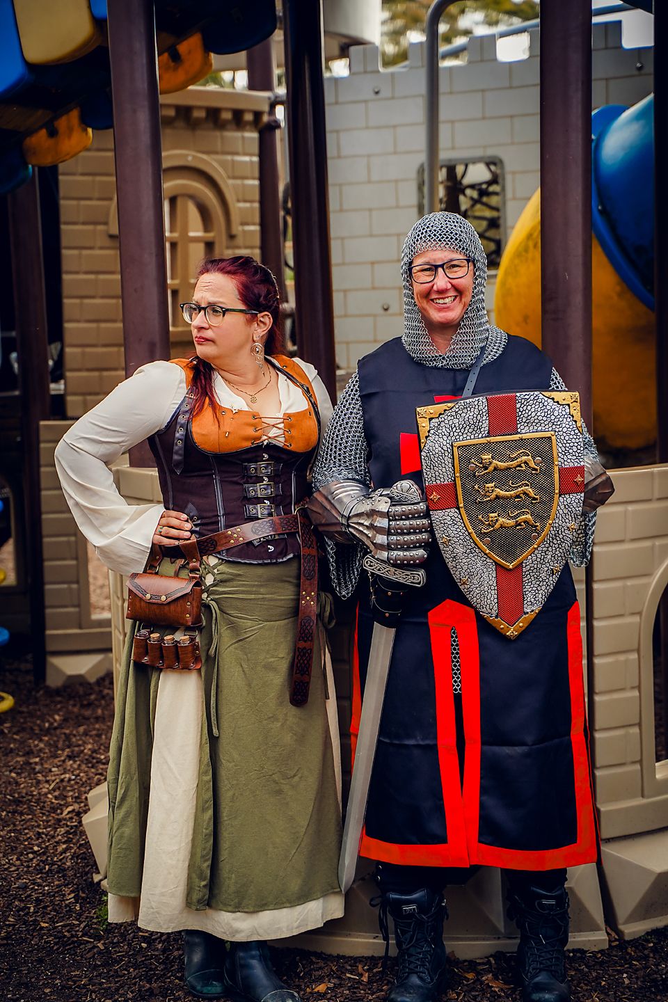 Medieval costumed figures pose with shields and period attire in a series of connected photos against a brick wall.