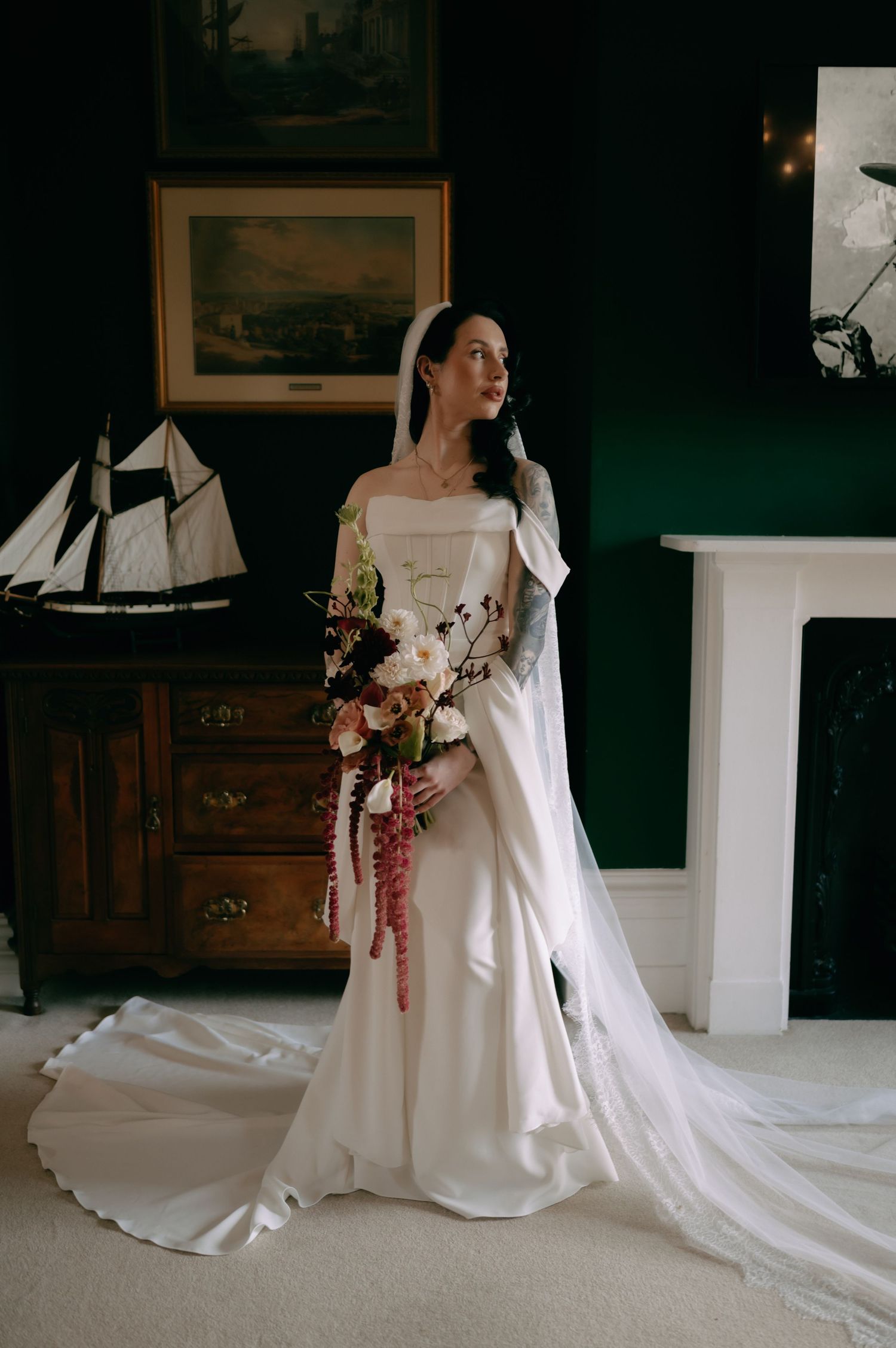 A sequence of photos showing a bride in a flowing white gown with long train posing in a dimly lit vintage room.
