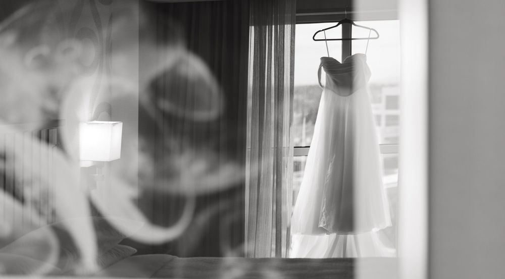 A series of black and white photographs showing smoke rising from burning candles in a dark, moody setting.