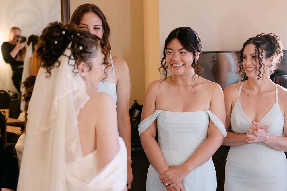A series of candid wedding moments showing joyful interactions between people in formal attire at an indoor venue.