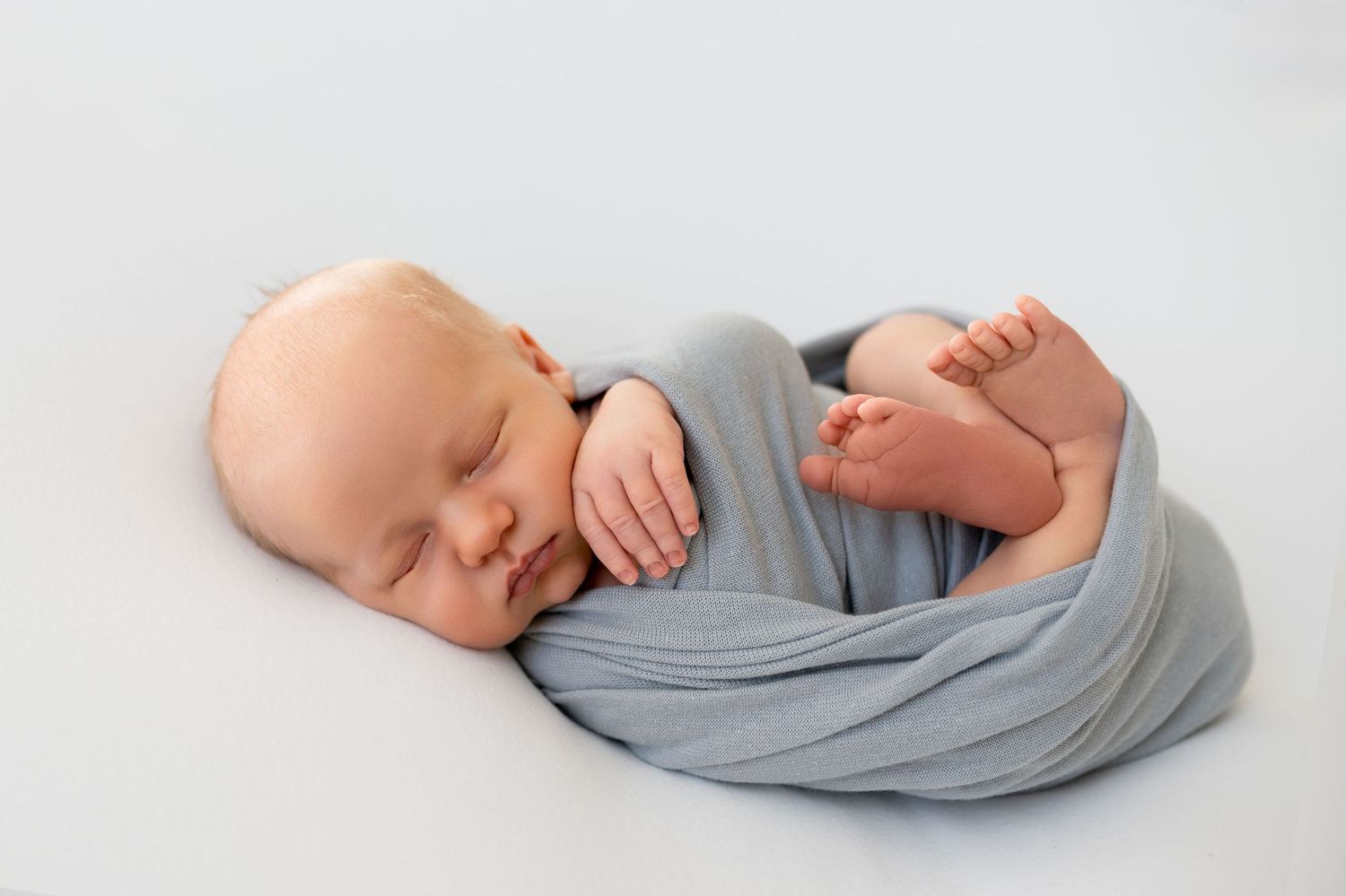 Fine art newborn baby boy portrait light colors Nashville Tennessee studio photography